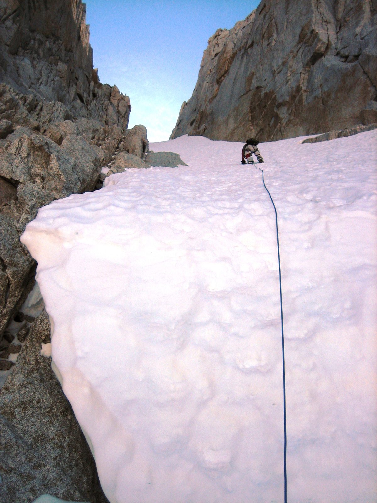 Having ascended the Bergschrund, John on lead. Placing an ice screw.